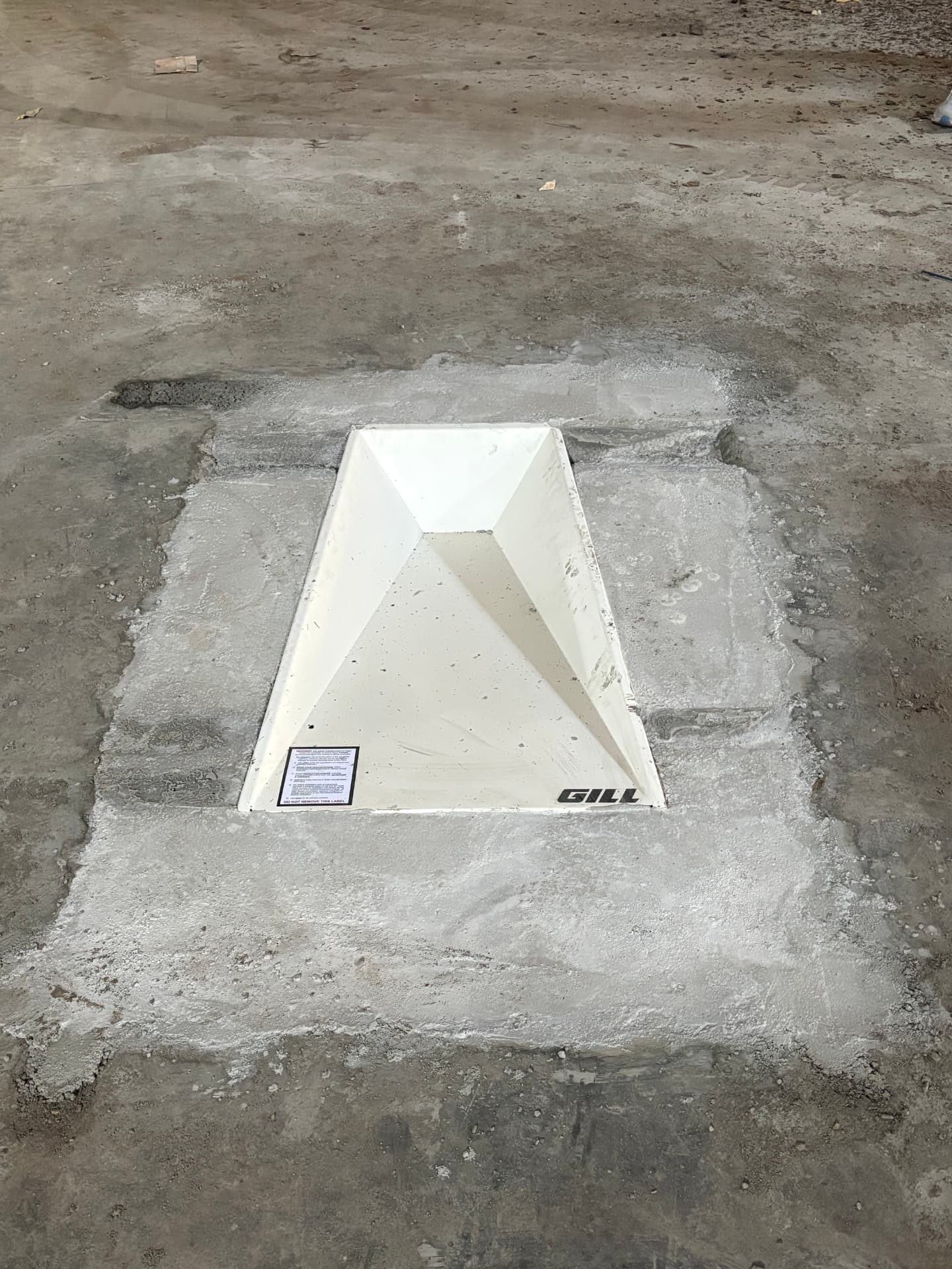 Aero Ranch construction — Gill pole vault box installed in the concrete floor.