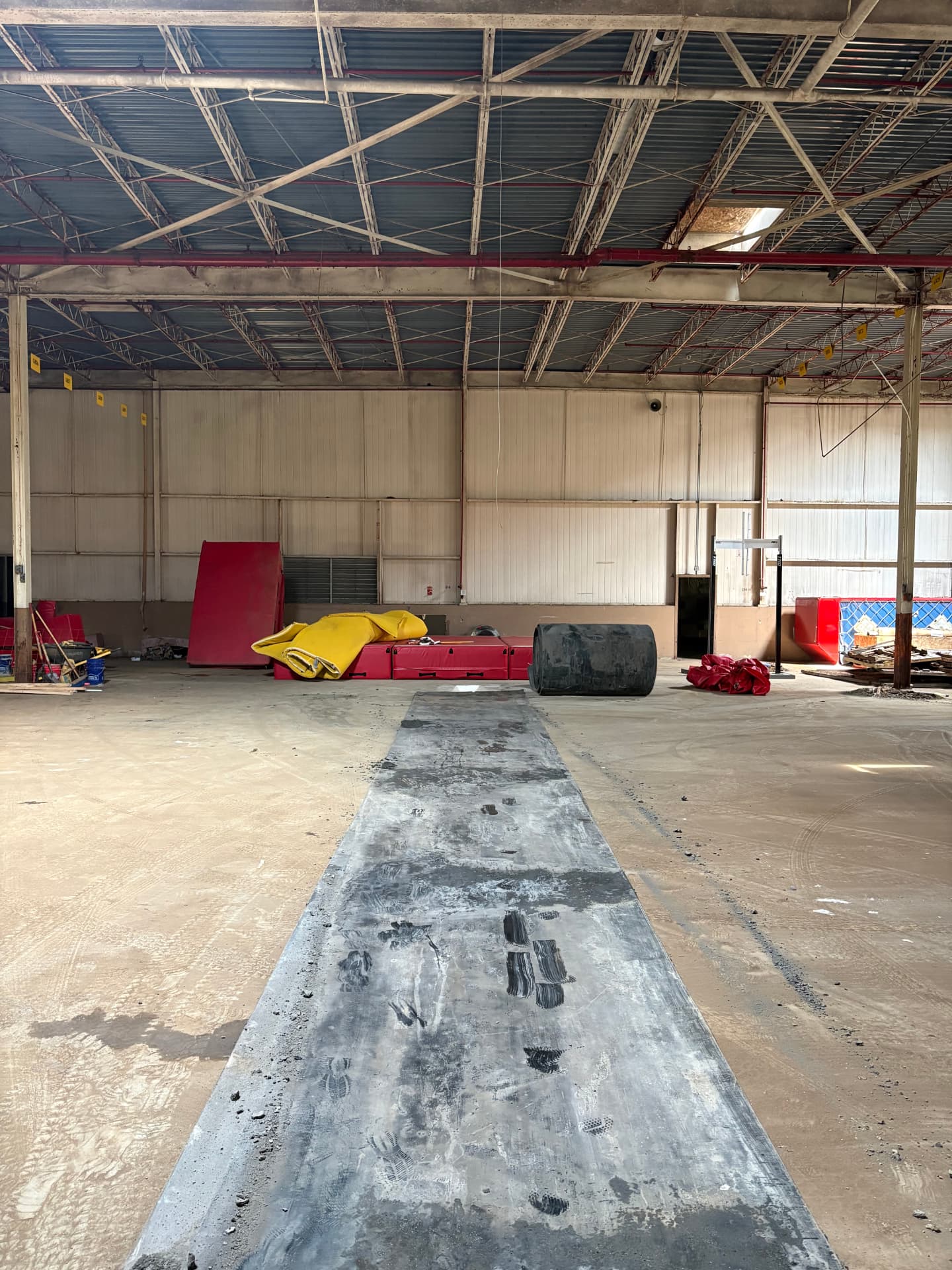 Aero Ranch construction — runway belting laid out before installation.