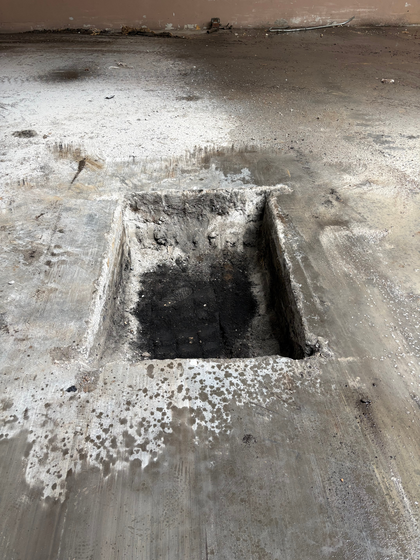 Aero Ranch construction — pole vault box footing poured into the concrete floor.